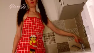 Hot housewife sexually rustles her apron in the kitchen