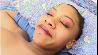 Guy gets his cock sucked by a black pregnant whore on the bed
