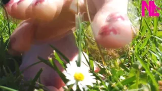 Nyllady Walking Barefoot on Th Grass in a Park