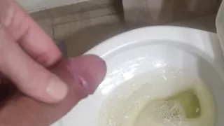 Playing with a pissing cock