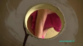 Veronica Avluv sucks a cock through a glory hole while masturbating