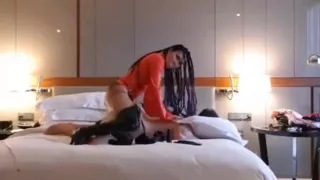 Pegging slave in hotel wearing red latex
