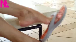 Dangling with Orange Flip Flops in a Swimming Pool