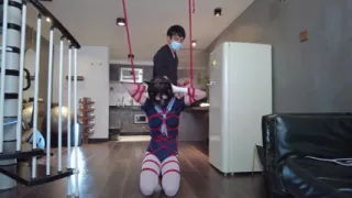 Mz31 - a Girl Tied and Suspended by a Red Rope Reaches Orgasm.