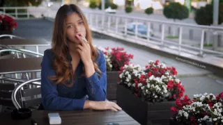 Magnetic Russian Beauty Playing with Cigarette Smoke