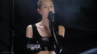 Brunette Smoking in Black Latex Outfit Slow Sensual Scene