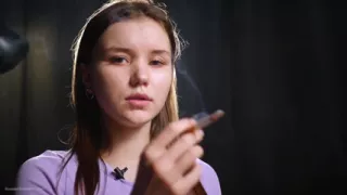 18 Aged Girl Is Smoking Two Strong Cork Cigarettes