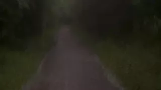 Long naked barefoot walk from car to a welcome to my town sign