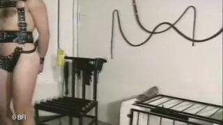 Slave tied up to a chair and whipped
