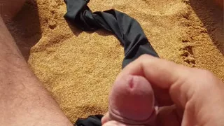 Ladysilva jerking off his big hot cock until he grasps on the deserted beach