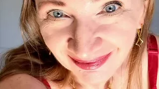Hottest GILF ever with huge tits teasing in red