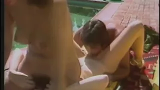 Hot babes enjoy as they give a huge pole a blowie outdoors then get fucked