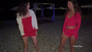Brunette Friends Piss Together on Beach