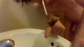 Peeing Draped Over a Sink