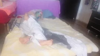 Sensual massage of a hot couple with oil on the body.