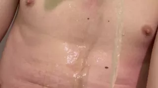 Young Ukrainian guy peeing on his own body
