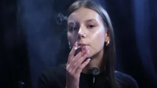 Young Girl Smoking Solo in a Calm Studio Session with Slow Exhales