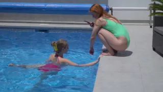 Lesbian Girls Are Having Fun in a Pool with an Inflatable Shark