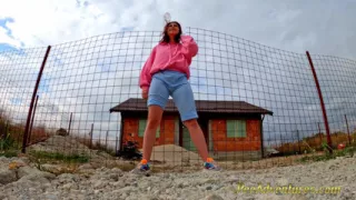 Hipster girl pee in her jeans - changing her wet shorts into dry pants
