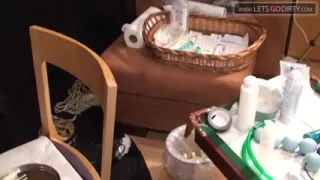 MILF lies on the bed as pussy gets injected wit syringes