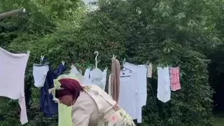 Dressed in a little dress to pick up the laundry