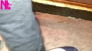 Dangling in Blue Ballet Flats in a Bar