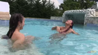 The water enhances all lesbian sensations while the lesbian scissoring in the pool continues on
