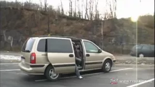 Brunette with Tattoos Gives Blowjob in Car Backseat