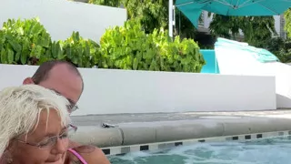 Getting frisky in the hot tub. Boob play.