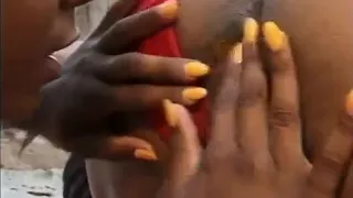 Two hot beautiful ebony chicks are getting their pussies drilled in the garden