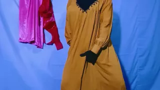 Indian wife sewing on the machine but she has other thoughts too