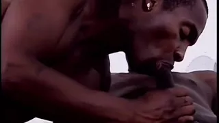 Black stud relaxes on the couch while his hard shaft gets sucked