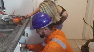 A beautiful Brazilian woman calls plumber