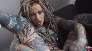Gorgeous tattooed girl fucks her ass with a big dildo