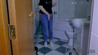 Filling a jar with her golden liquid