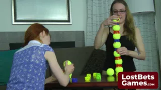 Two lesbians in an intimate Strip Ball Stacks challenge
