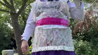 In gardener's clothes to take a piss shower outside fully dressed