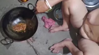 I was cooking naked when my husband came over and started squeezing my breasts.