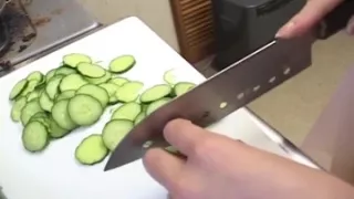 Insatiable Young Wife Drenches Cucumber Deep in Kitchen Sink