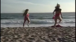 This tall redheaded lifeguard is showing her knockers and fucking her boyfriend