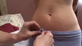 Mature brunette fucks guy with strap-on in bed