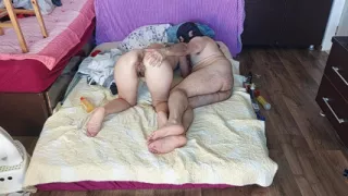 Sensual massage of a sexy couple with oil on the body.