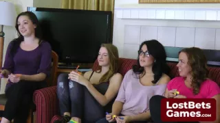 Sexy lesbian players pair up for a strip darts game