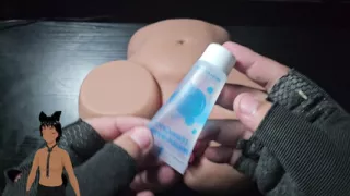 Playing with the pussy of a sex toy!