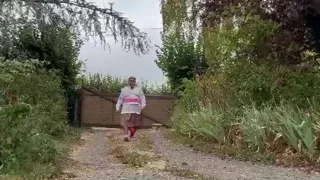 In a gardener outfit with a pink dress for a day