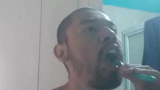 Handsome man washes his face