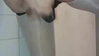 In the bathroom playing with my tail
