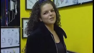Fabulous brunette with curly hair wants a new tattoo
