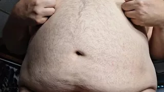 Chubby guy stands and cums