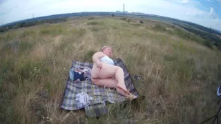 Fat Woman Masturbates With a Toy in the Field